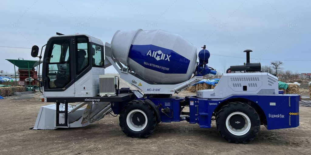 Self loading concrete mixer